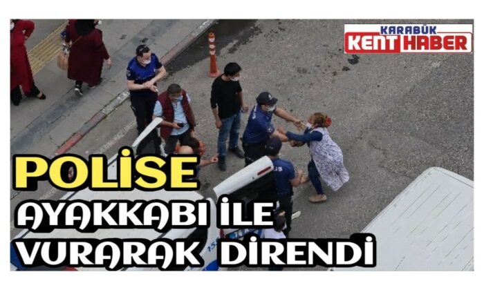 Polise ayakkabı ile vurarak direndi