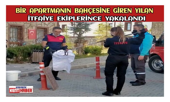 BİR APARTMANIN BAHÇESİNE GİREN YILAN İTFAİYE EKİPLERİNCE YAKALANDI